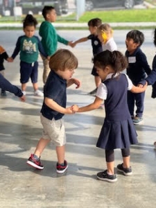 students holding hands